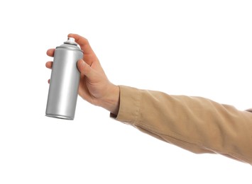 Man holding can of spray paint on white background, closeup