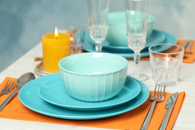 Photo of Elegant festive setting on white wooden table