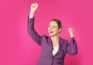 Photo of Portrait of emotional young businesswoman on color background