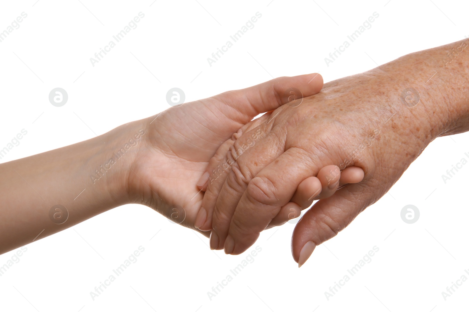 Photo of Young and elderly women holding hands together on white background, closeup