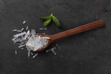 Photo of Menthol crystals and mint leaves on grey background, flat lay