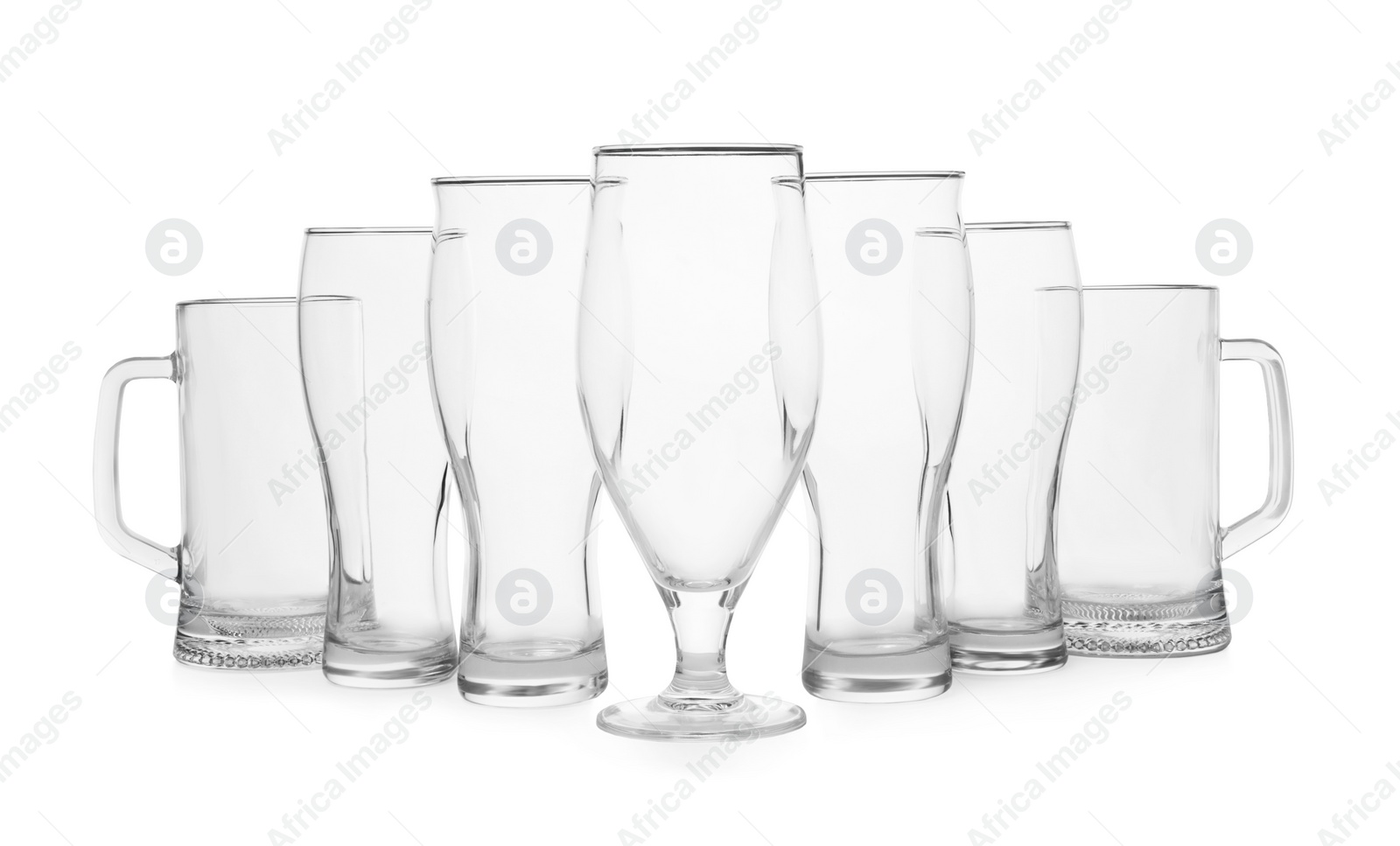 Photo of Different elegant empty glasses isolated on white