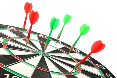 Photo of Dart board with color arrows hitting target, closeup