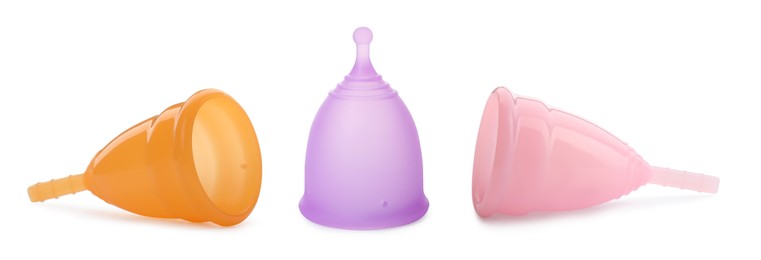 Image of Set with different menstrual cups on white background. Banner design