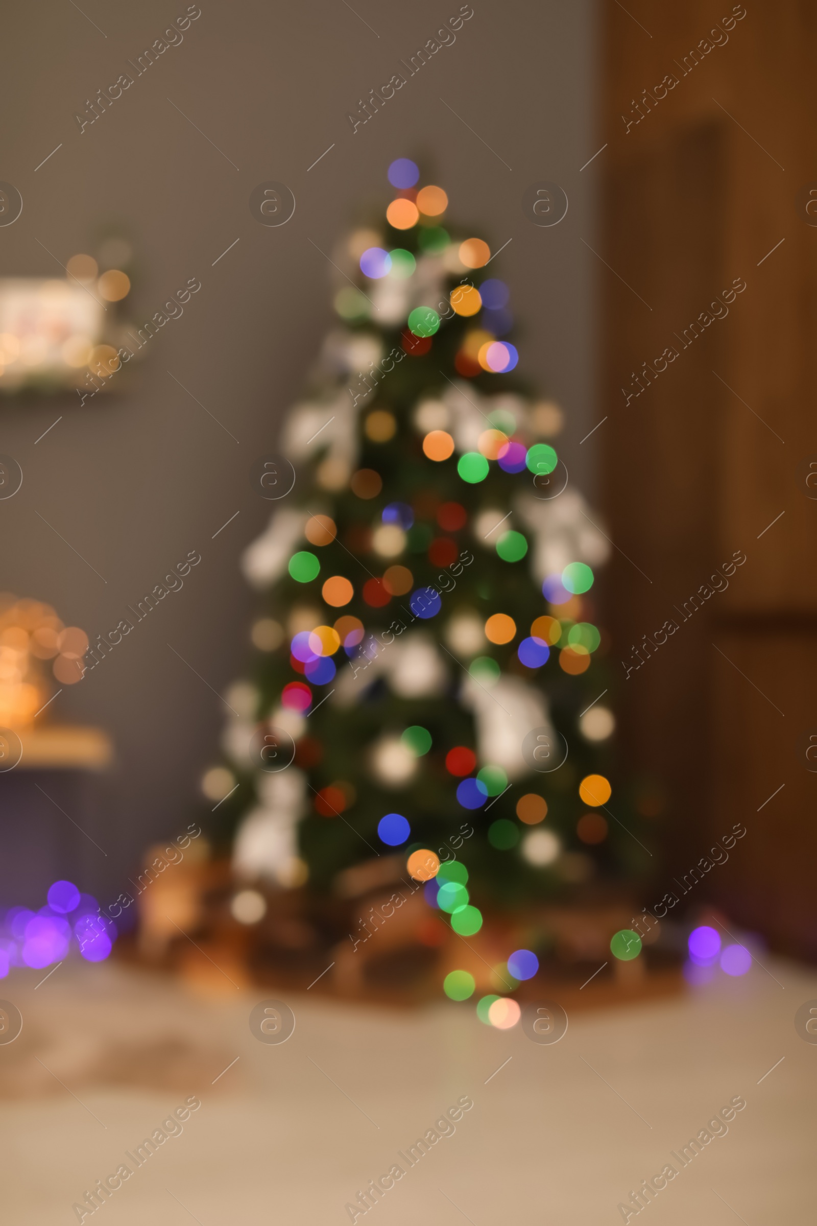 Photo of Blurred view of room with beautiful Christmas tree