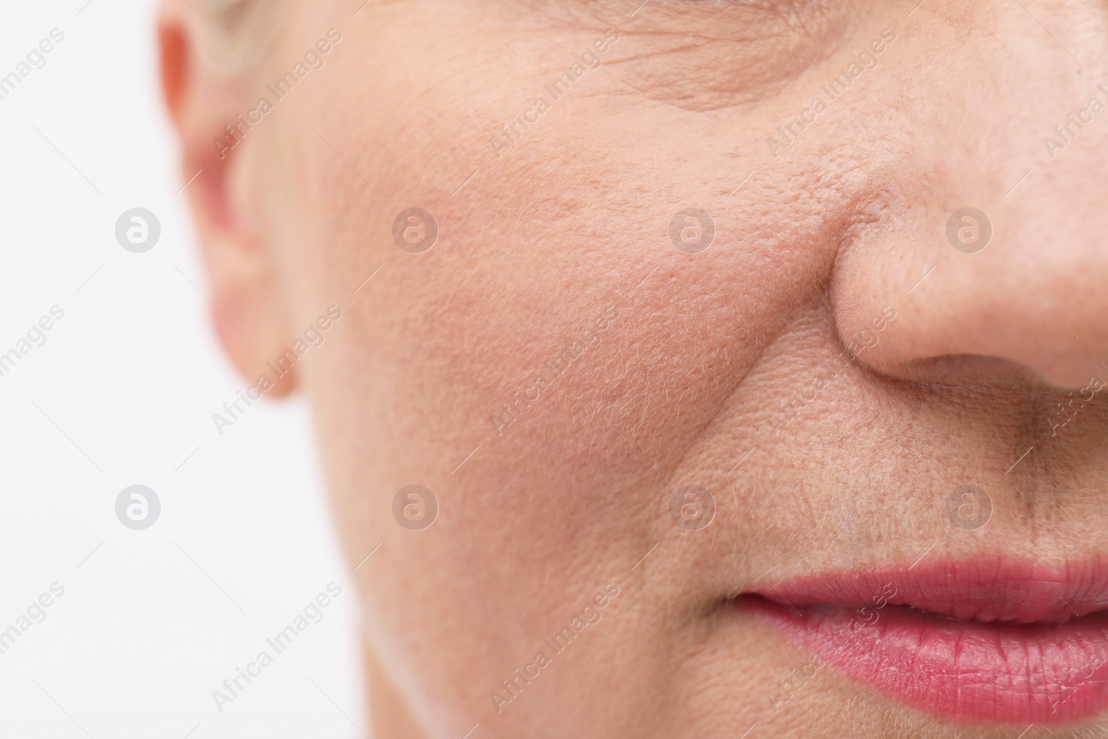 Photo of Closeup view of beautiful older woman on white background