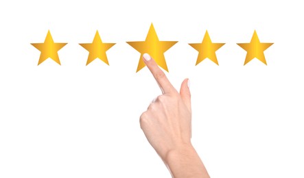 Quality evaluation. Woman touching virtual golden stars on white background, closeup