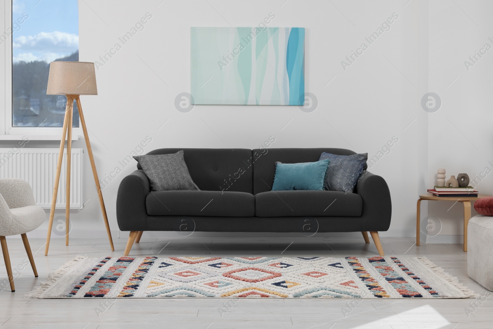 Photo of Living room with beautiful carpet and furniture