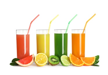 Glasses with different juices and fresh fruits on white background