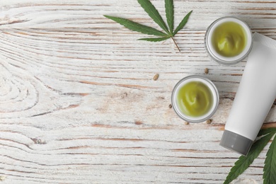 Photo of Flat lay composition with hemp cream on white wooden table, space for text. Organic cosmetics