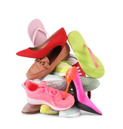 Pile of various female shoes isolated on white