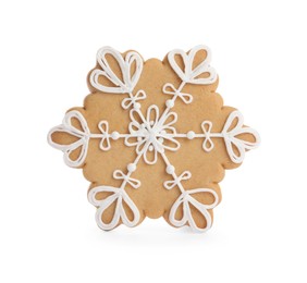 Photo of Tasty gingerbread cookie in shape of snowflake on white background. St. Nicholas Day celebration