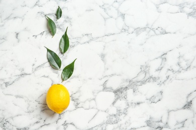 Photo of Flat lay composition with lemon and leaves on marble background