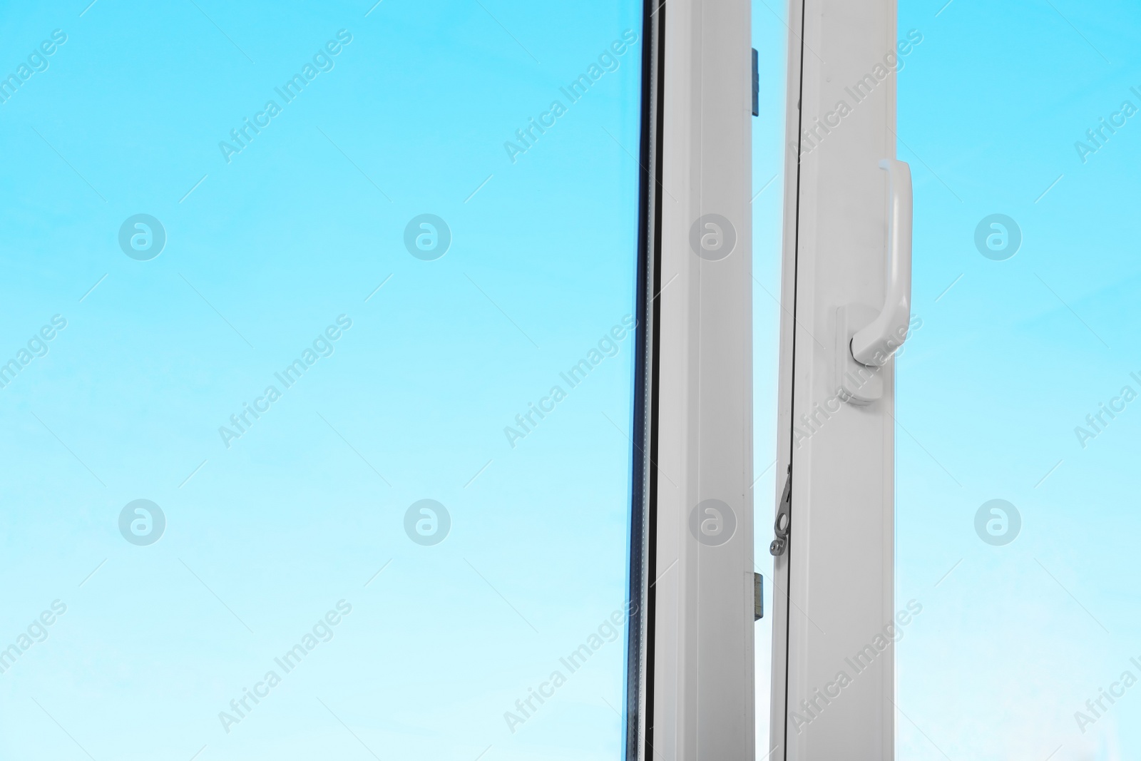 Photo of View of blue sky through modern window indoors