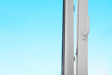 View of blue sky through modern window indoors