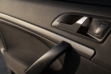 Photo of Closeup view of car door with handle