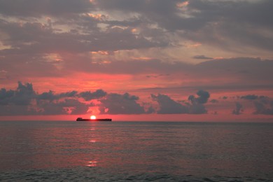 Picturesque view of sunset with clouds over sea