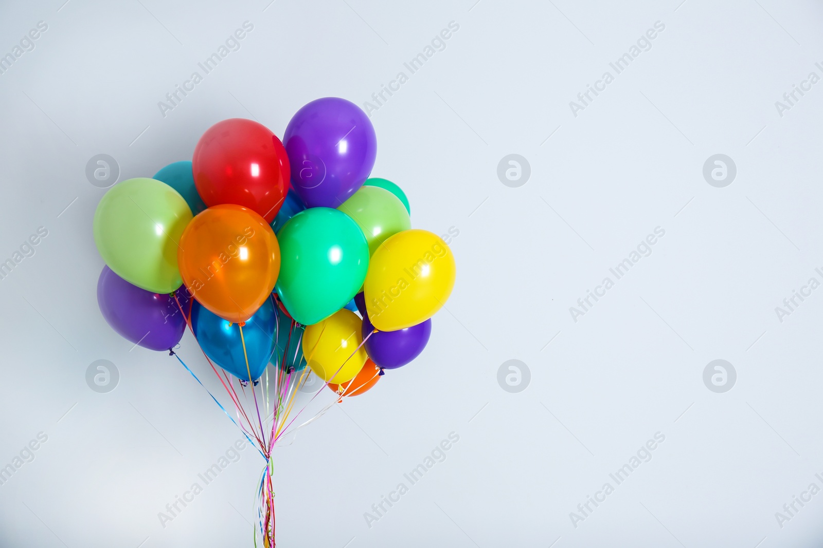 Photo of Bunch of colorful balloons on white background. Festive decor