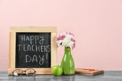 Composition with small chalkboard for Teacher's day on table