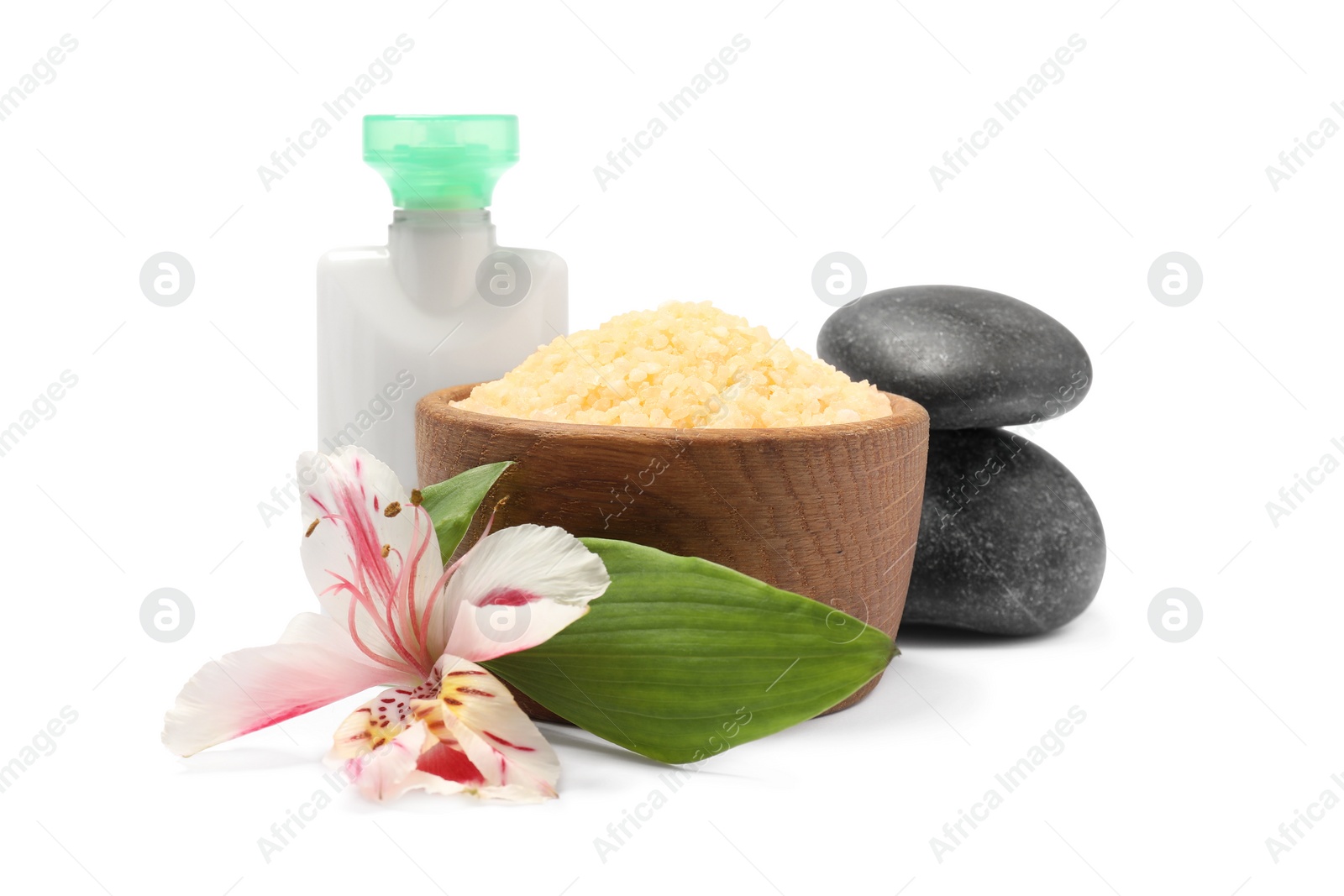 Photo of Orange sea salt in bowl, cosmetic product, spa stones and flower isolated on white