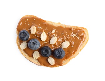 Photo of Toast with tasty nut butter, blueberries and peanuts isolated on white, top view