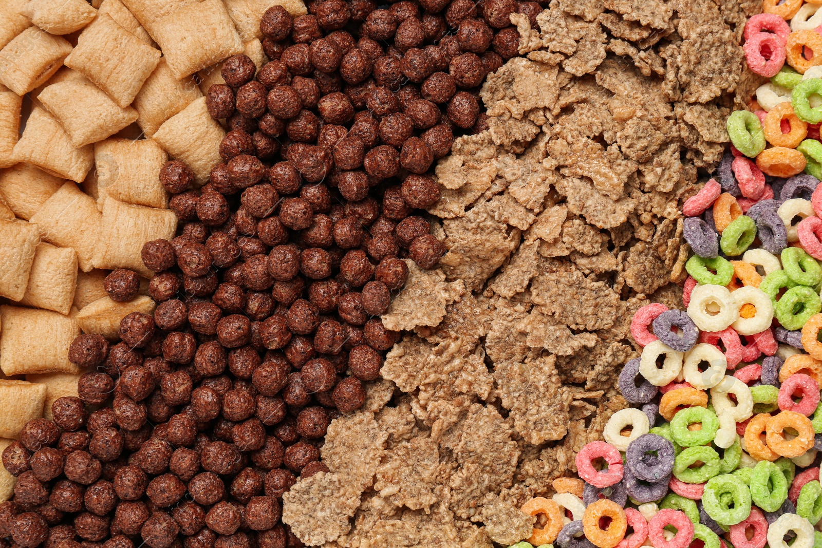 Photo of Different types of dry breakfast as background, top view