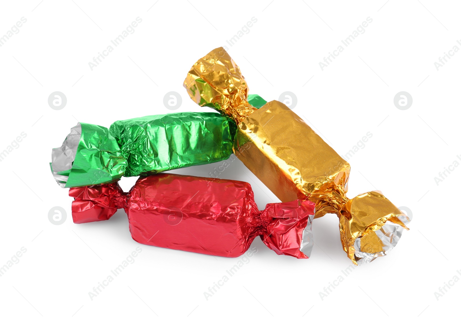 Photo of Tasty candies in colorful wrappers isolated on white