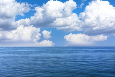 Image of Beautiful view of seascape and blue sky with white clouds on sunny day