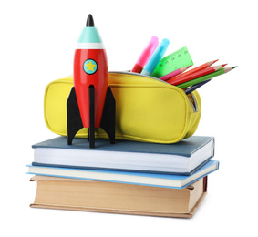 Photo of Bright toy rocket and school supplies on white background