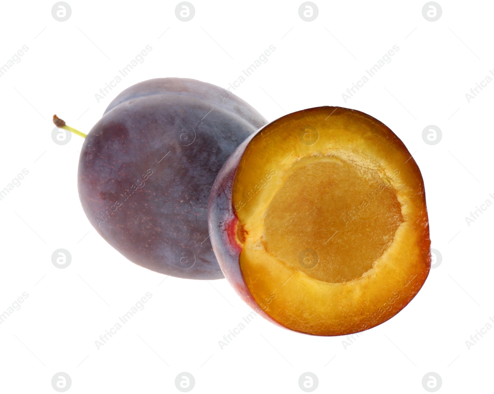 Photo of Whole and cut ripe plums isolated on white