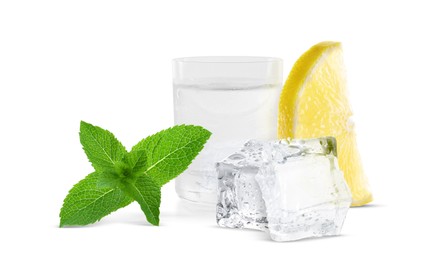 Image of Shot of vodka with ice, lemon and mint on white background