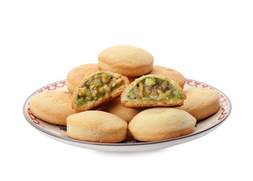 Photo of Plate with traditional cookies for Islamic holidays isolated on white. Eid Mubarak