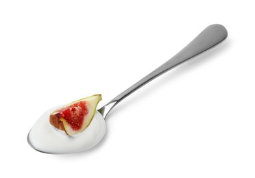 Photo of Spoon with yogurt and fig isolated on white
