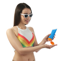 Photo of Young woman applying sun protection cream on white background