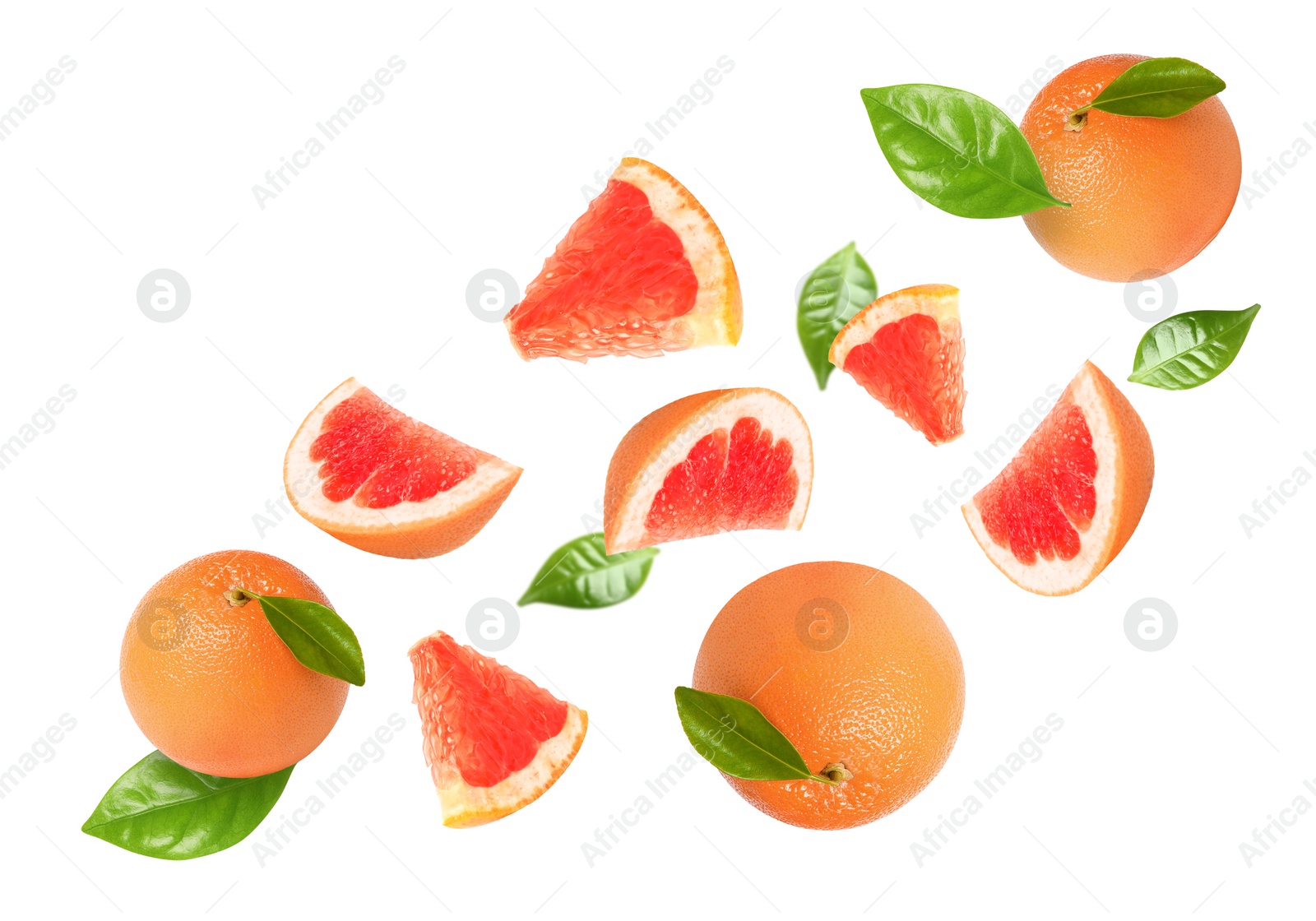 Image of Tasty ripe grapefruits and green leaves falling on white background