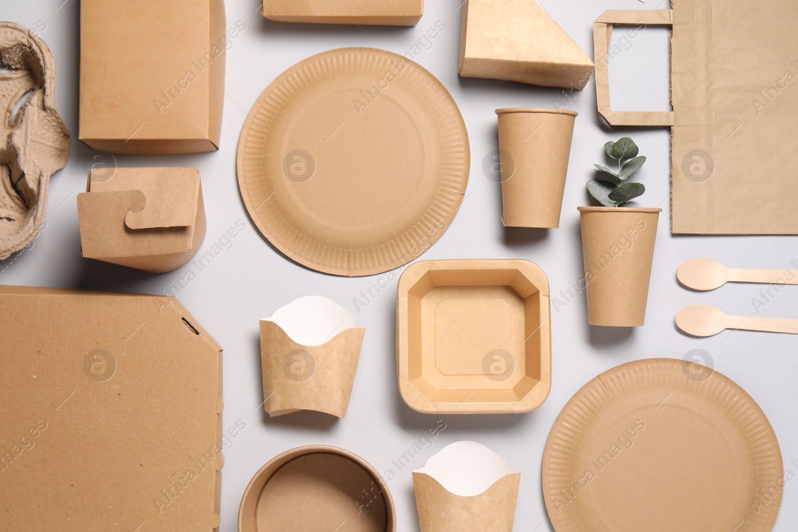 Photo of Flat lay composition with eco friendly food packagings on light grey background