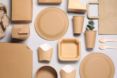 Photo of Flat lay composition with eco friendly food packagings on light grey background