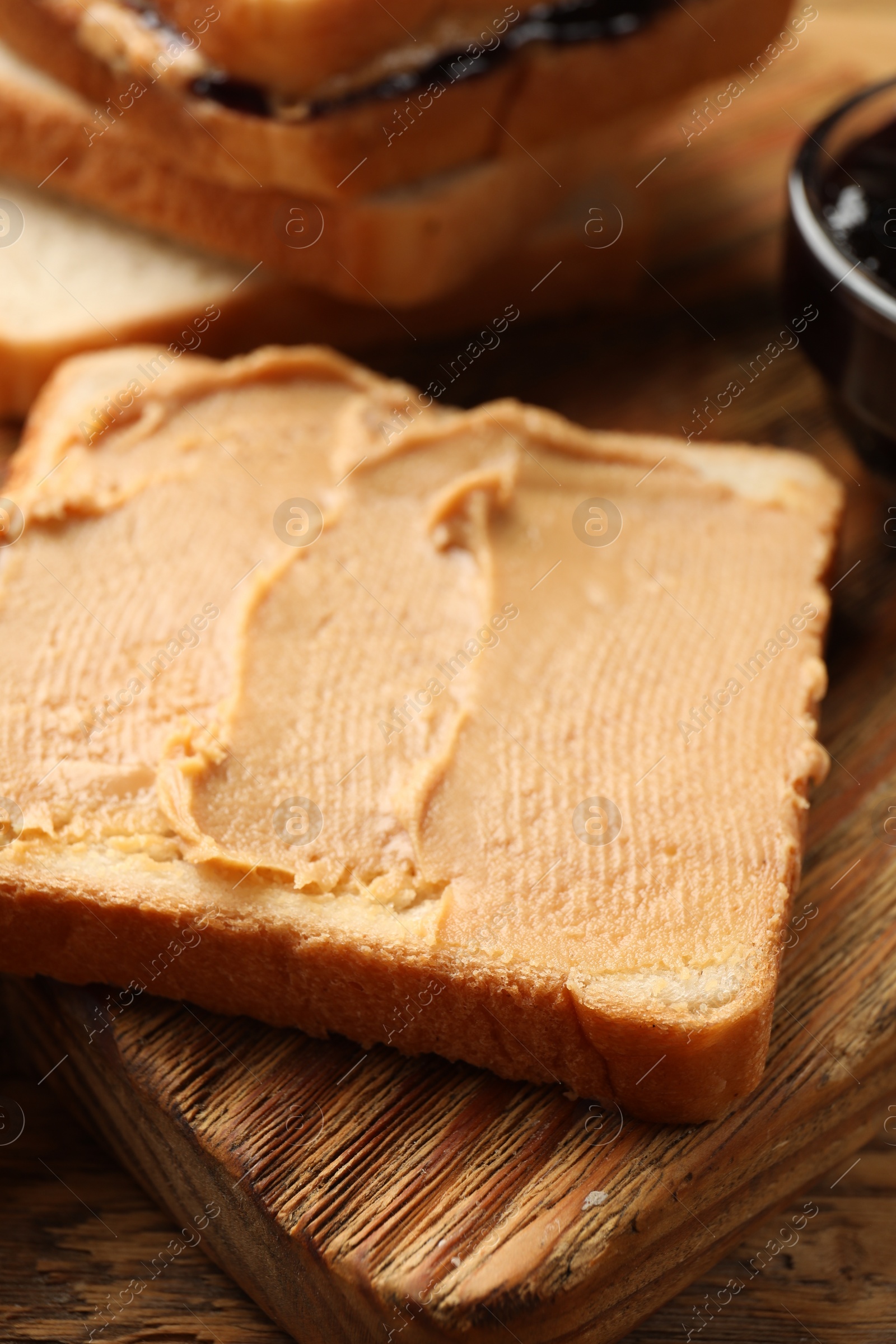 Photo of Tasty peanut butter sandwich on table, closeup view