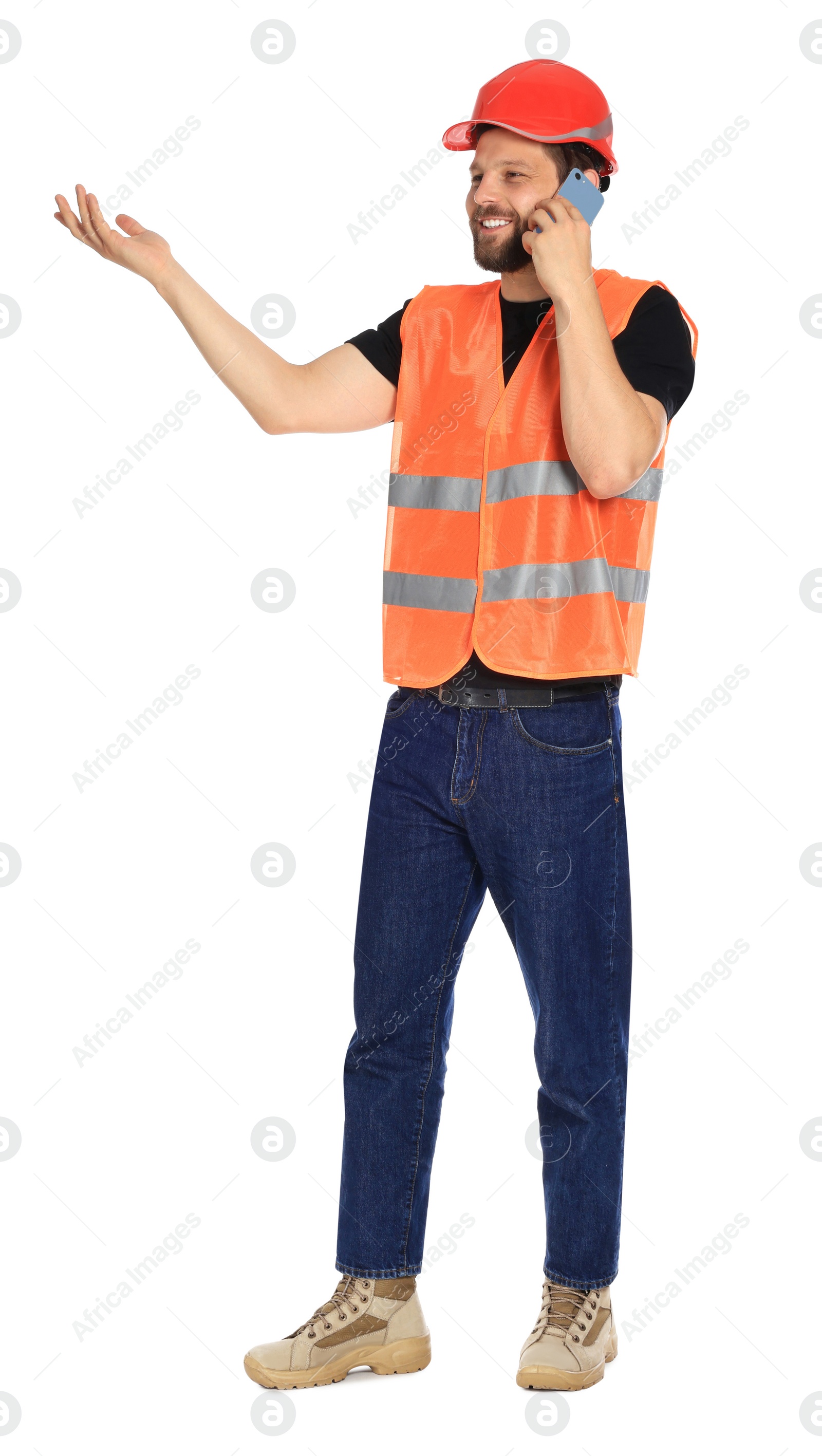 Photo of Man in reflective uniform talking on smartphone against white background