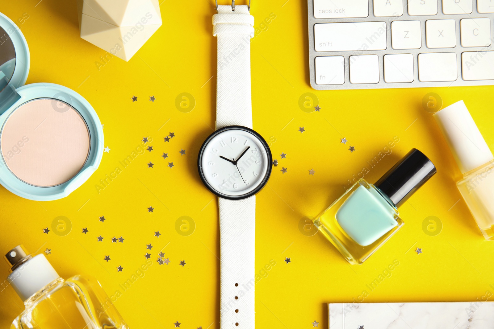 Photo of Flat lay composition with stylish wrist watch on table. Fashion accessory