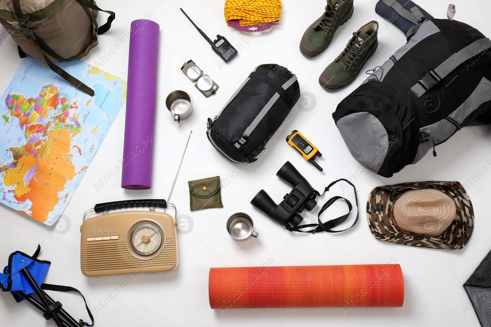 Photo of Flat lay composition with camping equipment on white background