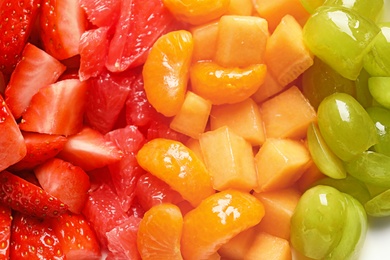 Photo of Different fresh cut fruits, closeup