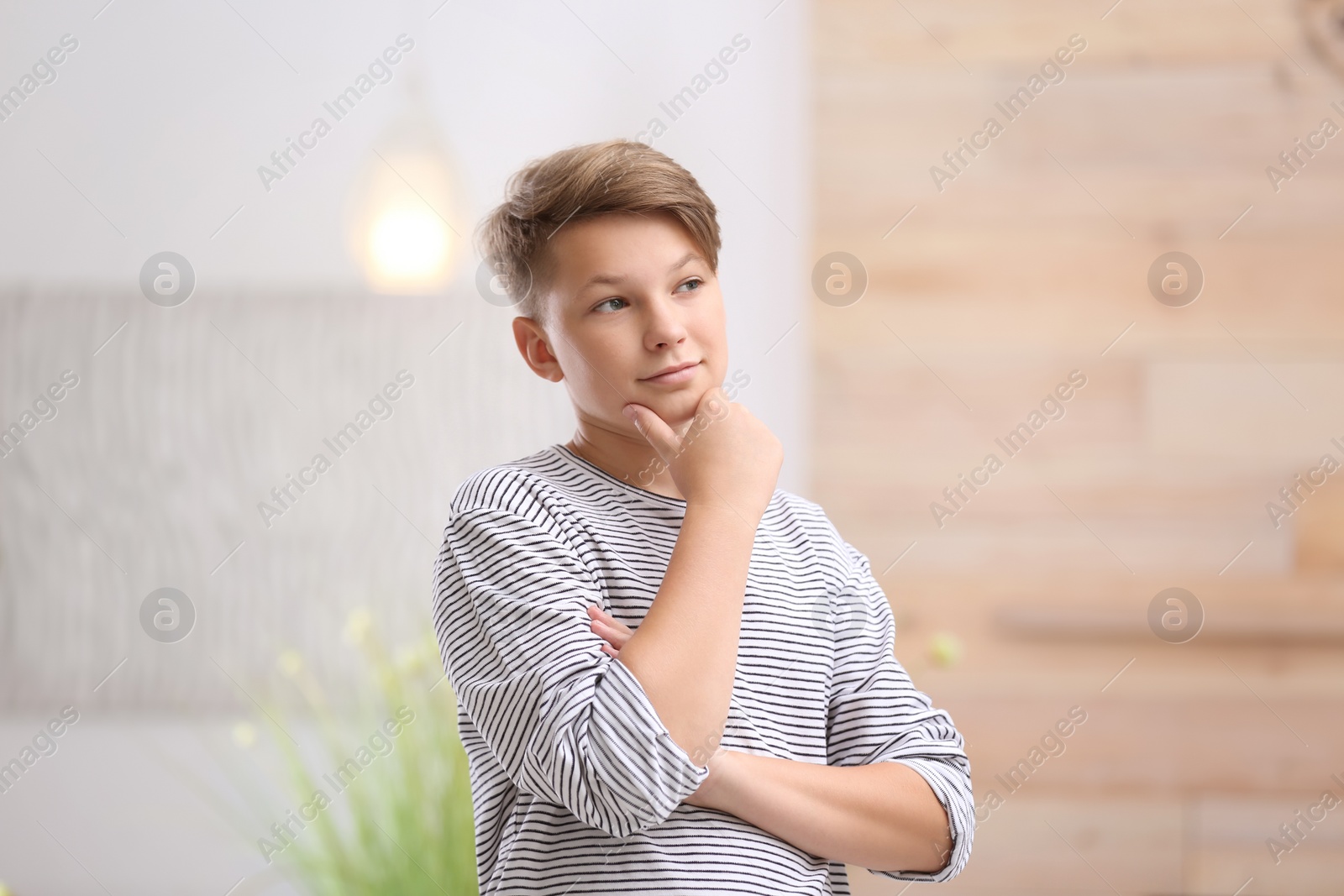 Photo of Teenage boy in casual clothes on blurred background