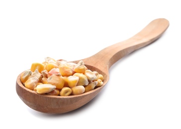 Photo of Wooden spoon with corn kernels on white background