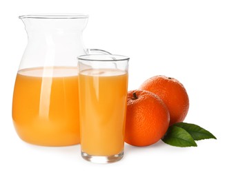 Photo of Orange juice, fresh fruits and green leaves on white background