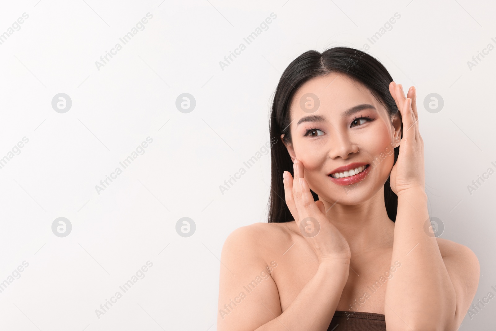 Photo of Portrait of beautiful woman on white background