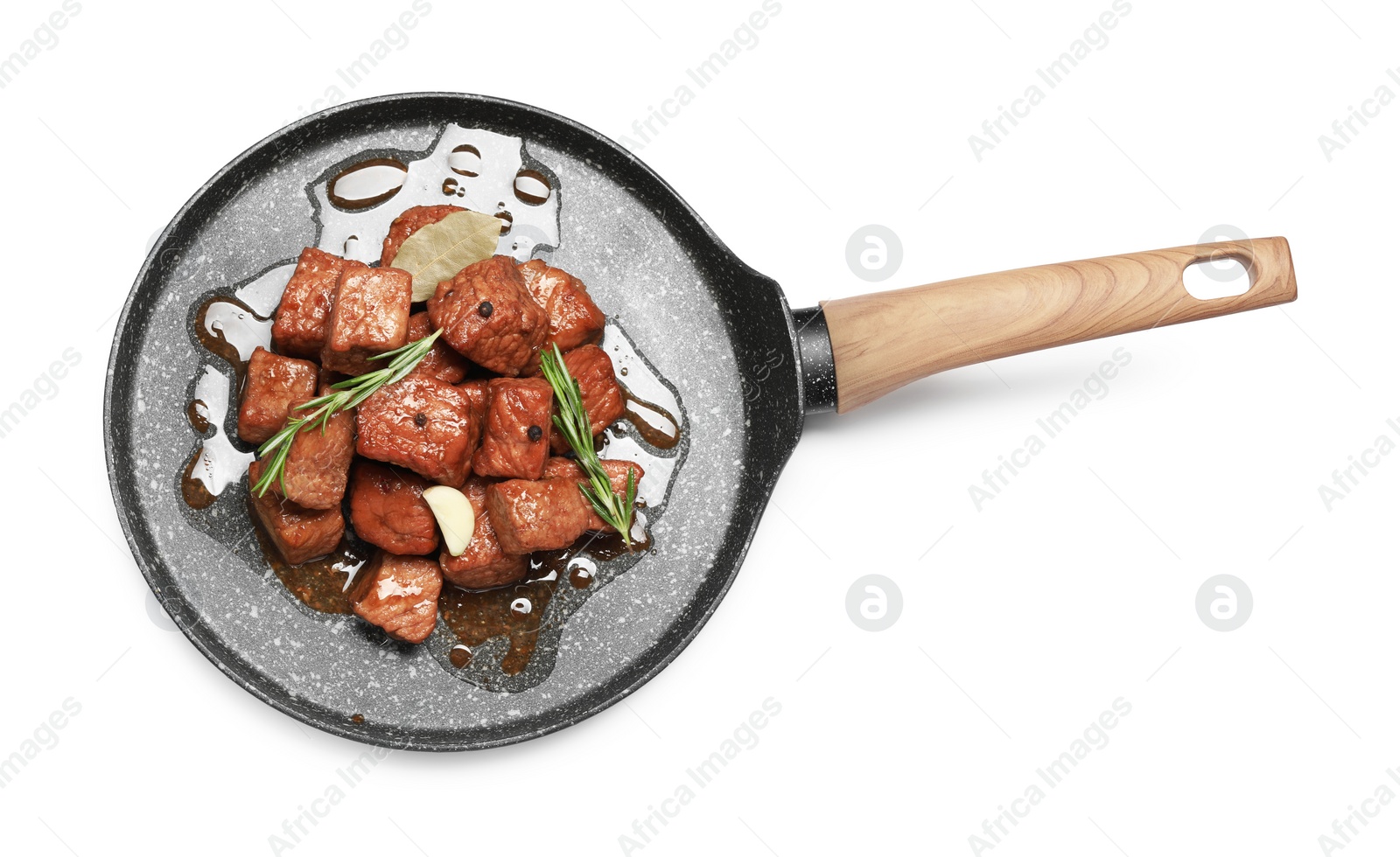 Photo of Frying pan with delicious goulash isolated on white, top view