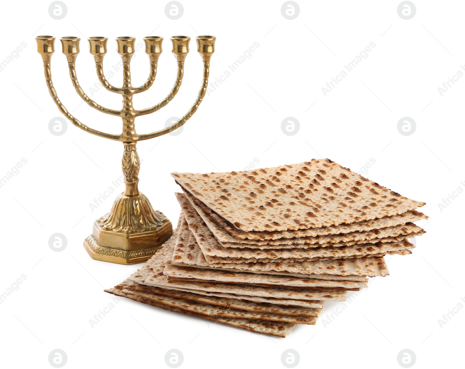 Photo of Matzo bread and menorah on white background