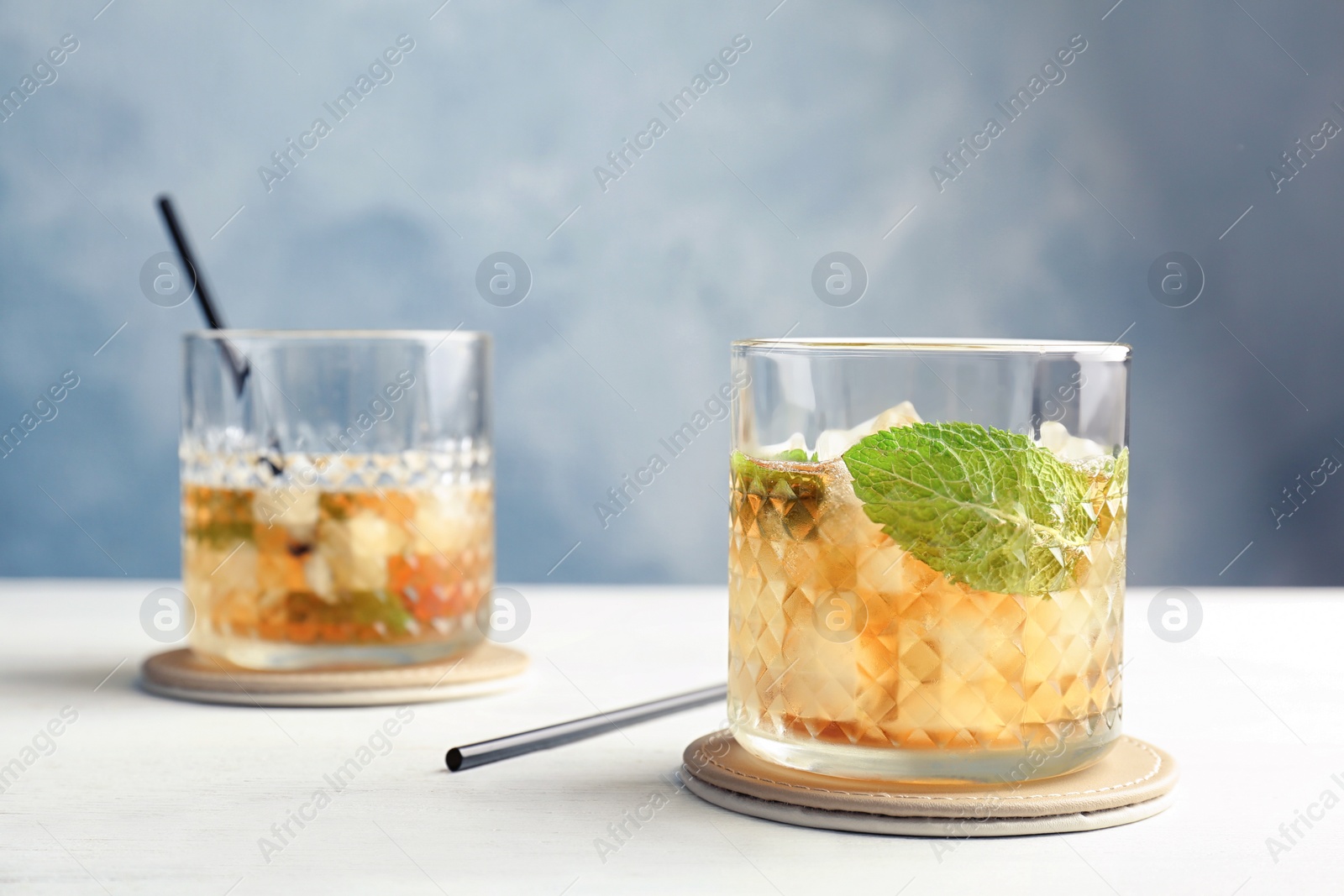 Photo of Delicious mint julep cocktail on table