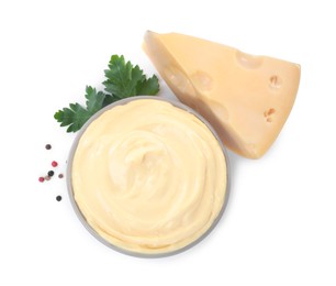 Photo of Tasty cheese, sauce, parsley and peppercorns on white background, top view